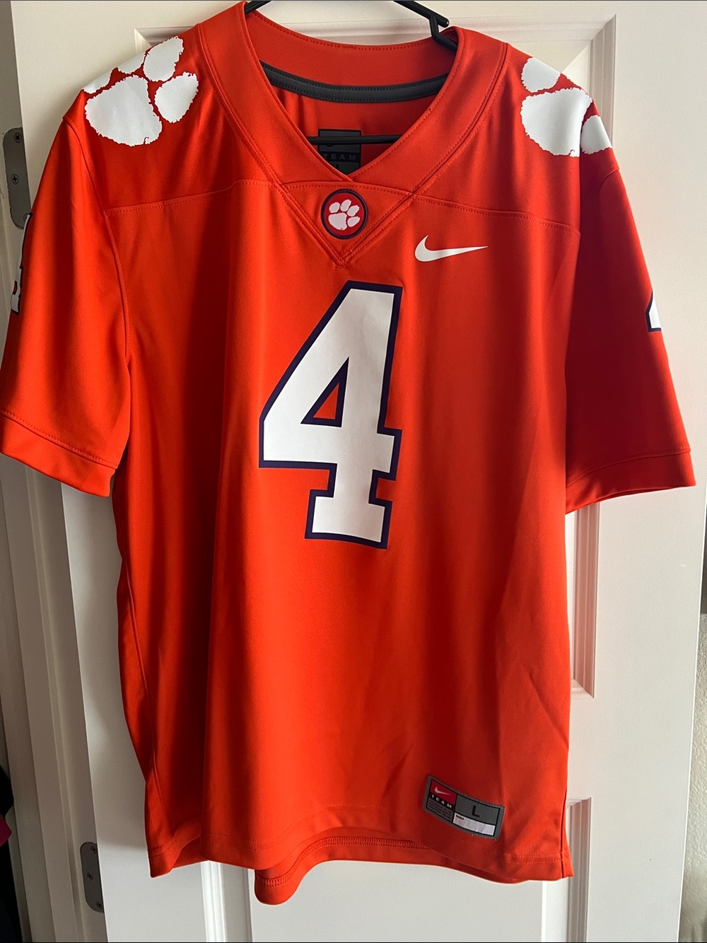 Nike Orange Football Jersey with White Number 4 and Navy Outline